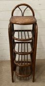 A Mid Century Bentwood and cane open shelving unit (H97cm W30cm D32cm)