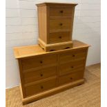 A light oak chest of drawers along with a single bedside (H88cm W132cm D45cm) (Bedside H68cm W51cm