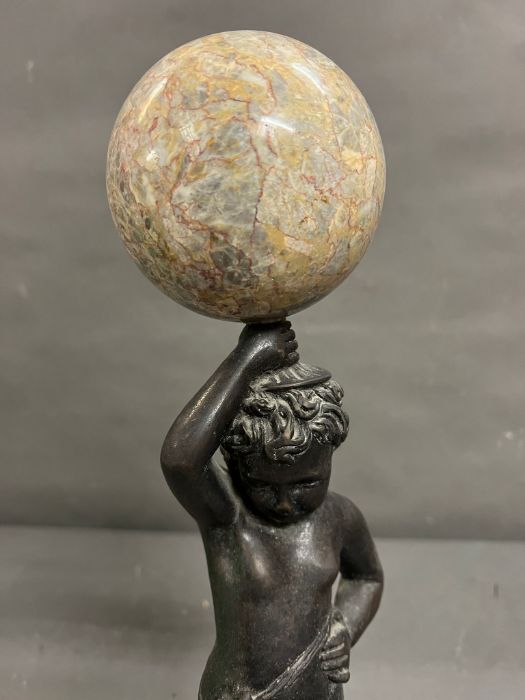 A bronze and marble statue of a boy holding a marble ball above his head - Image 2 of 7
