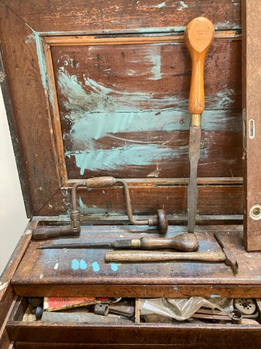 A large vintage wooden steal banded tool box with cast iron handles containing and extensive - Image 6 of 8