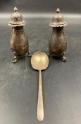 Pair of hallmarked silver cruets and a silver spoon.