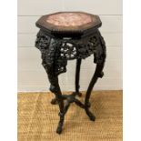 A Chinese stand table with marble octagonal top and carved frame AF (H92cm)