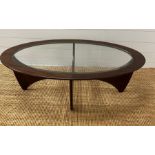 A G-Plan Astro oval table with glass top (H42cm W122cm D66cm)