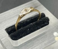 An antique diamond and gold ring on a platinum setting (Approximate Total Weight 1.4g) Size M