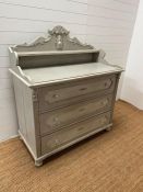 A French Louis style chest of drawers, the scrolling gallery back and shelf are sat upon a base of