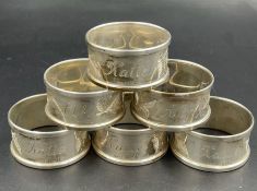 A set of six engraved silver napkin rings by Henry Griffith & Sons Ltd, hallmarked for Birmingham