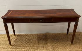 A console table with drawer to centre and fluted legs (H70cm W138cm D40cm)