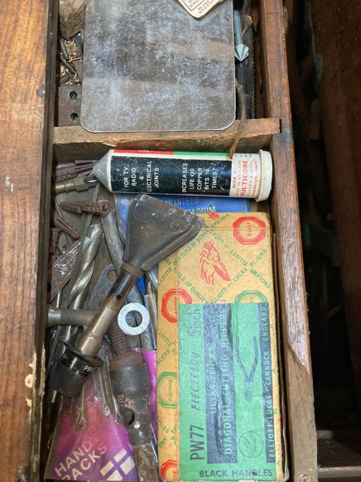 A large vintage wooden steal banded tool box with cast iron handles containing and extensive - Image 3 of 8