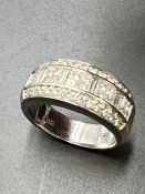 A 14ct white gold ring set with approximately 46 diamonds. Size N