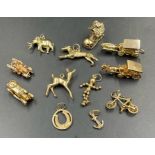 A selection of 9ct gold charms to include cars, horse and carriage and an elephant. 43.4g