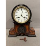 A cased mantel clock