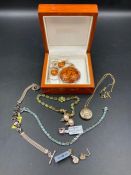 A selection of costume jewellery to include a peridot style bracelet and aquamarine style