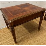 A regency style side table on fluted legs and drawer (H56cm W67cm D58cm)