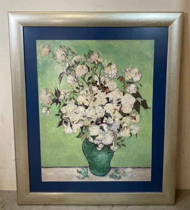 A framed print of white roses in the style of Van Gogh