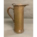 A trench art artillery shell converted into a jug