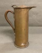 A trench art artillery shell converted into a jug