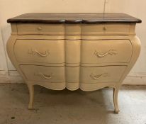 A white painted Louis XV style Bombe commode with three drawers and down swept legs Height 89