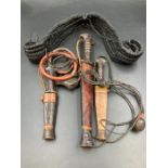 A selection of three African tribal knifes in sheaths along with two further tribal items.