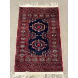 A Yallameh style rug with red ground (114cm x 64cm)