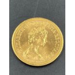 A 1980 Sovereign gold coin.