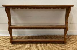 A two tiered wall hanging plate rack
