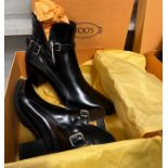 A pair of black Tod's boots with two buckets size 42