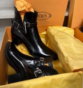 A pair of black Tod's boots with two buckets size 42