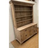 A light beech country house dresser, three adjustable shelves, sat on drawers and cupboard base (