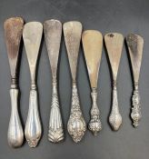 A selection of seven silver hallmarked handled shoehorns, various makers, sizes and hallmarks.