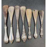 A selection of seven silver hallmarked handled shoehorns, various makers, sizes and hallmarks.