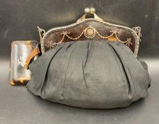 An antique Ladies handbag with silver mounts, hallmarked for London 1919 by Charles & Richard