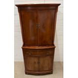 A Georgian style Serpentine fronted drink cabinet, pull out drawer and a two drawer cupboard to base