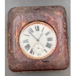 A white metal travel clock in leather case, marked Argentum.