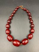 A cherry amber graduated necklace