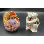 Two boxed Royal Crown Derby paperweights, Cockerel and Bear Hug, one with gold stopper.