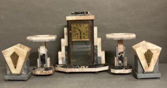 A marble Art Deco mantle clock with garniture