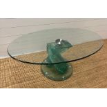 A glass coffee table with two central fan glassed columns. 120cm L x 45cm H)