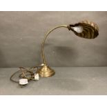 An art deco style brass shell table lamp
