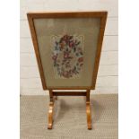 A needlework embroidery fire screen or side table