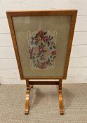 A needlework embroidery fire screen or side table