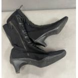 A pair of Prada black lace up boots