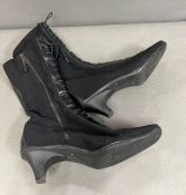 A pair of Prada black lace up boots