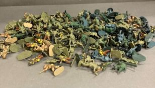 Two tubs of various plastic soldier figures