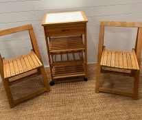A pine kitchen trolly and two folding chairs