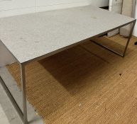 A large chrome table with felt covered wooden top, designed by the architect Wells Mackereth