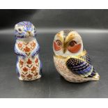 Two boxed Royal Crown Derby paperweights, Owl and Meerkat, both with gold stoppers
