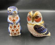 Two boxed Royal Crown Derby paperweights, Owl and Meerkat, both with gold stoppers