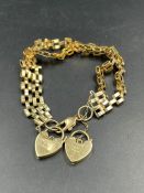 A 9ct gold gate bracelet with heart shaped fasteners (Approximate Total Weight 13.3g)