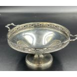 A Hallmarked silver bowl on a single foot with two handles and pierced decoration (Approximate Total
