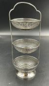 A silver three basket table display, approximately 17cm in height, hallmarked for Birmingham 1909.